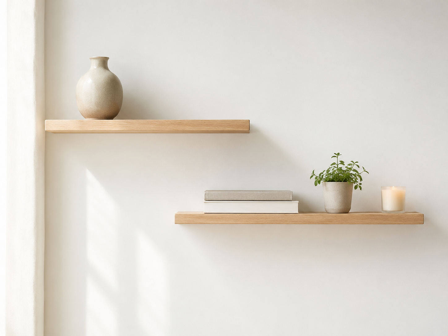 Minimal floating shelf styling with empty space and carefully placed decor